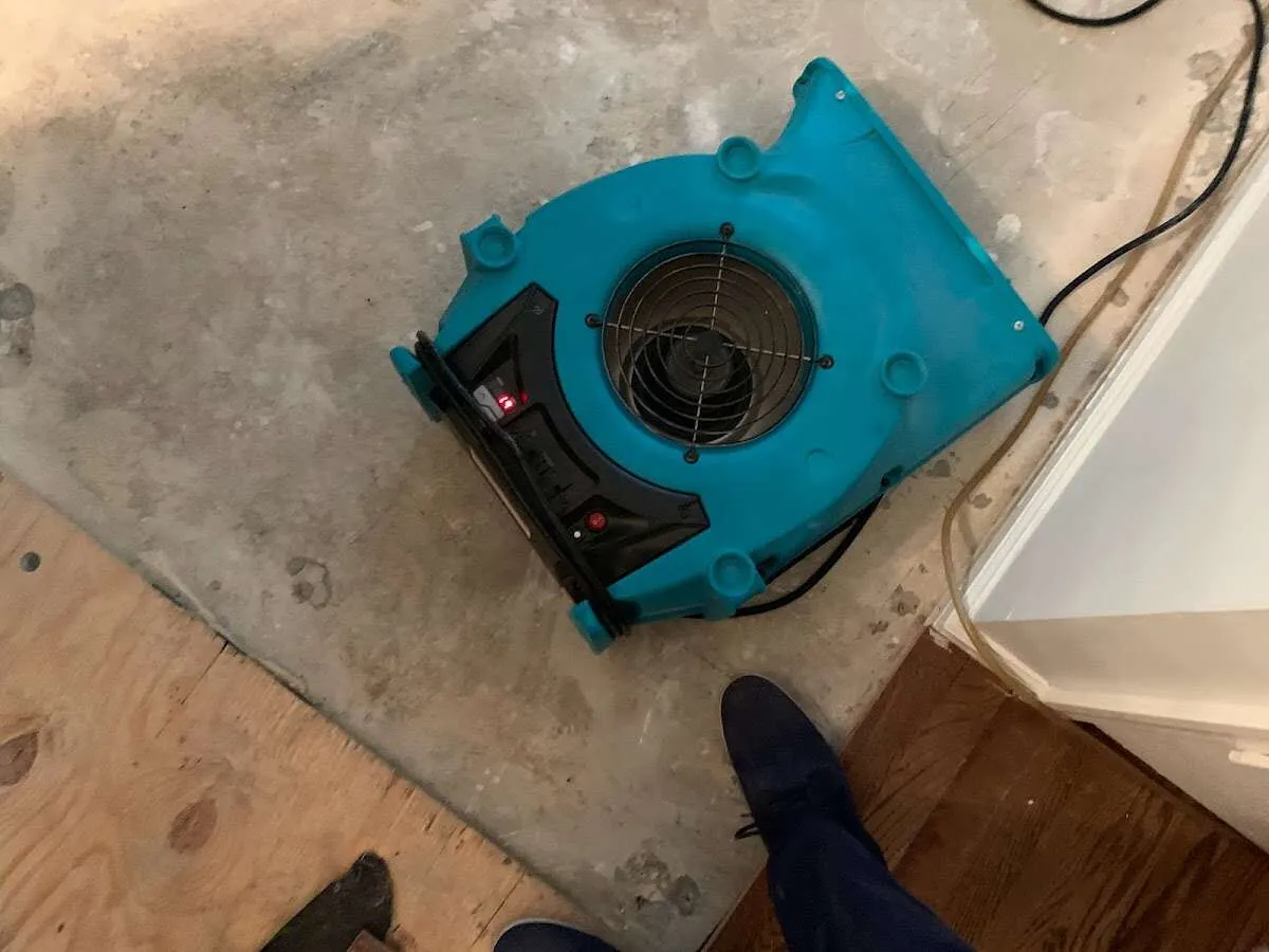 Air mover drying subfloor during Commercial Water Damage Restoration in Redwood Falls